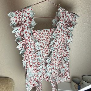 Beautiful open back tie blouse from Anthropologie. Embroidered cut outs